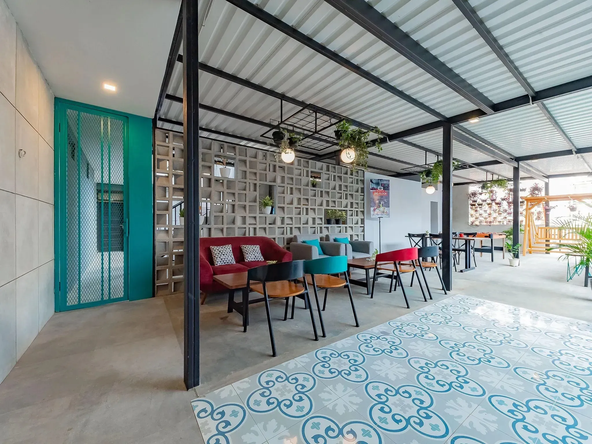 On-site restaurant and lounge area with tables and colorful chairs